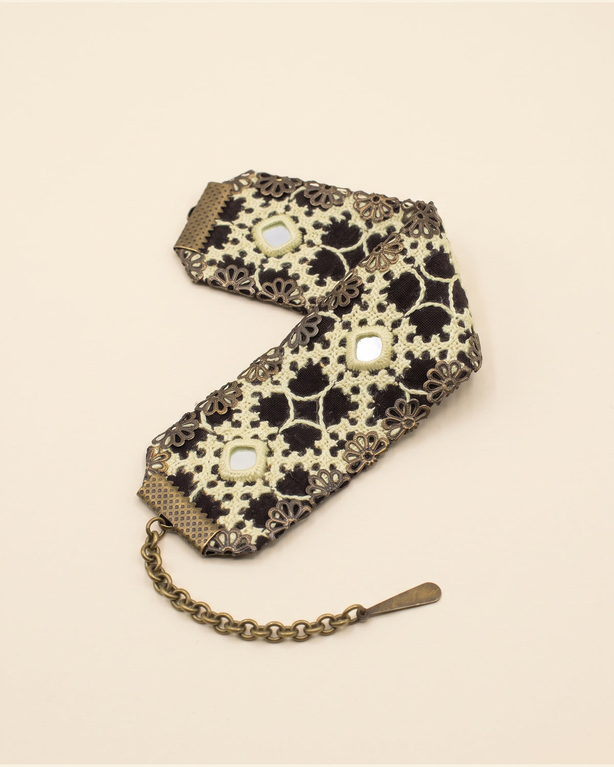 Handmade Balochi embroidered bracelet, cream, gold — packshot