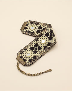 Handmade Balochi embroidered bracelet, cream, gold — packshot