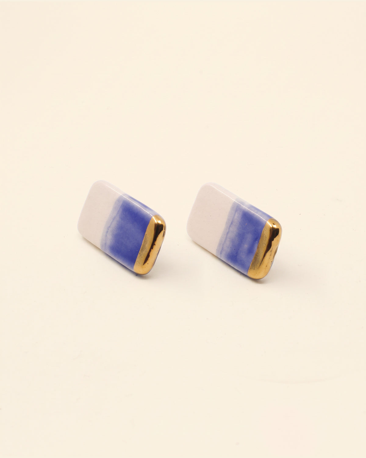 Handmade gold plated earrings, black, cream, gold — packshot