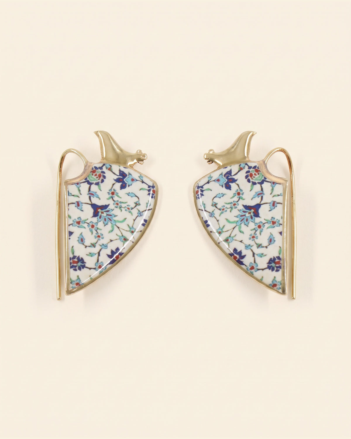 Siin handcrafted brass earrings, gold and white, on ivory