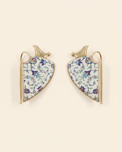 Siin handcrafted brass earrings, gold and white, on ivory