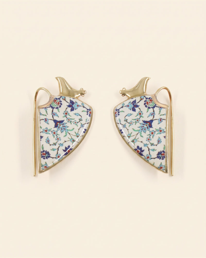Siin handcrafted brass earrings, gold and white, on ivory