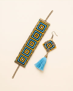 Handmade Balochi embroidered earrings and bracelet, yellow, blue — packshot