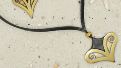 Necklace with gold heart-shaped pendants