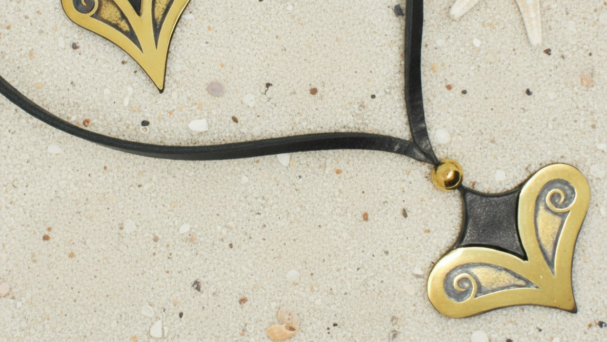 Necklace with gold heart-shaped pendants