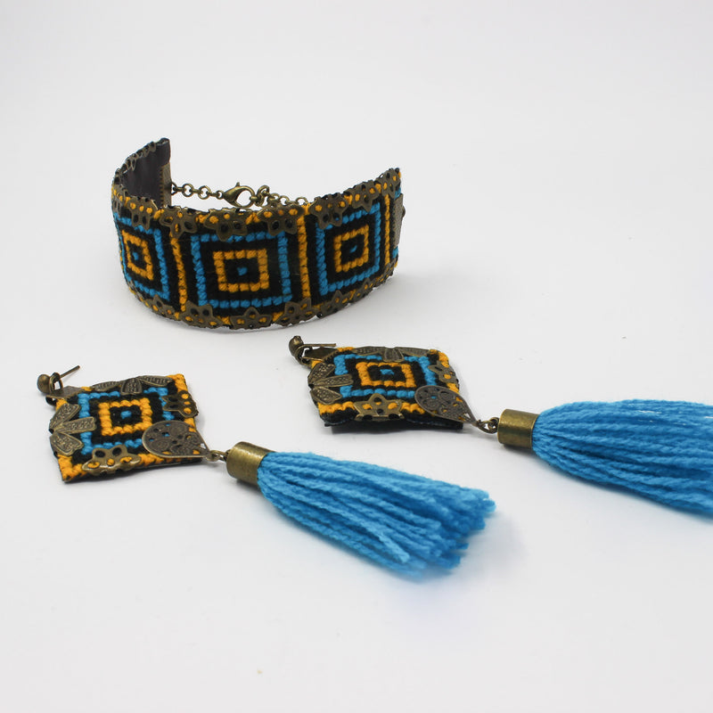 Handmade Balochi embroidered earrings and bracelet, yellow, blue — detail